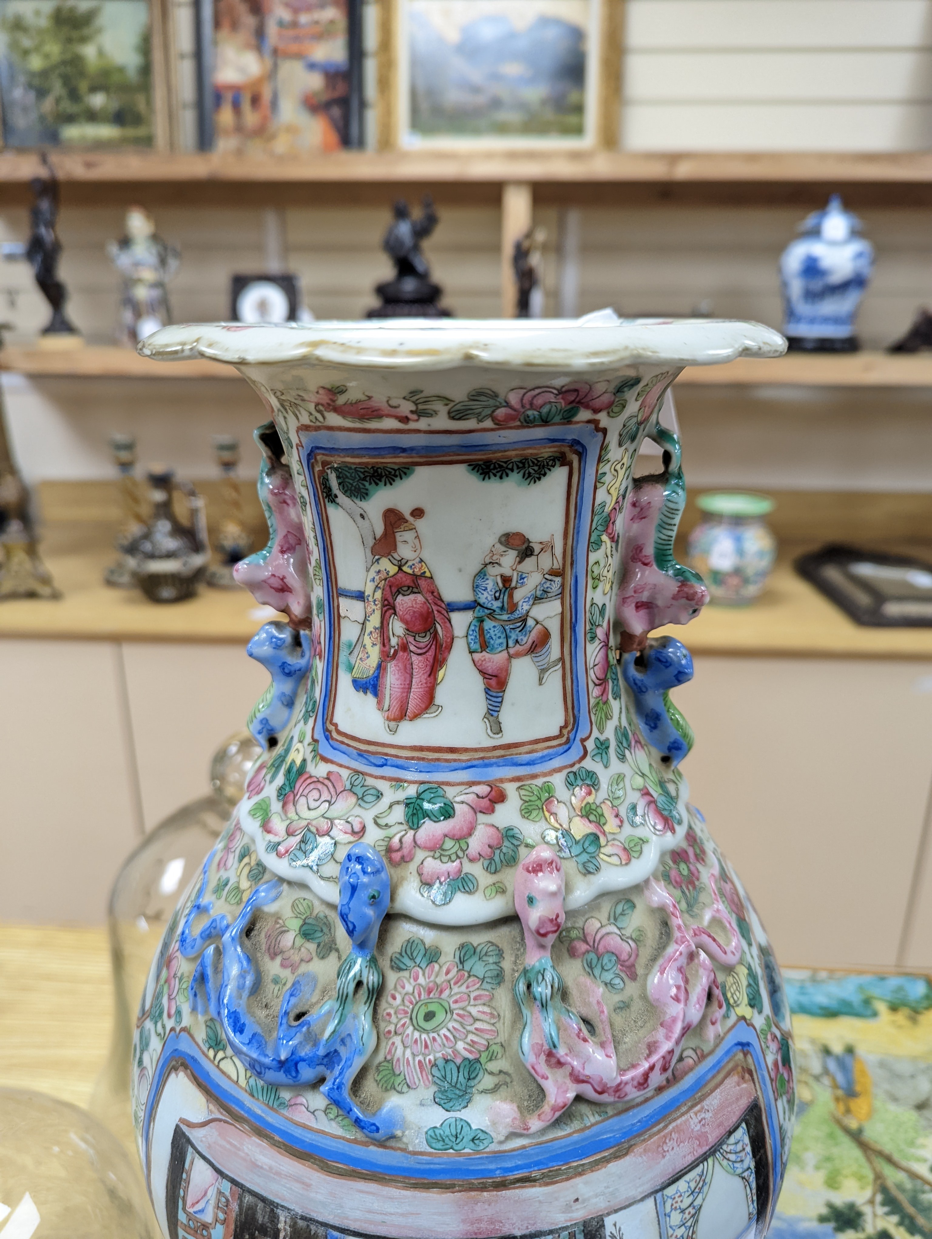 A large Chinese famille rose two handled vase, late 19th century, wood stand, restored 54cm incl stand